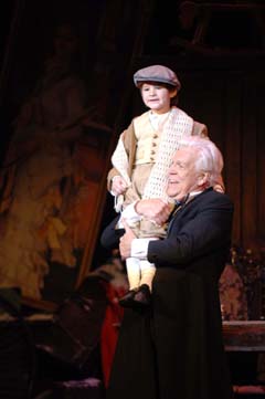 Eli Tokash as Tiny Tim and Tom Atkins as Scrooge
